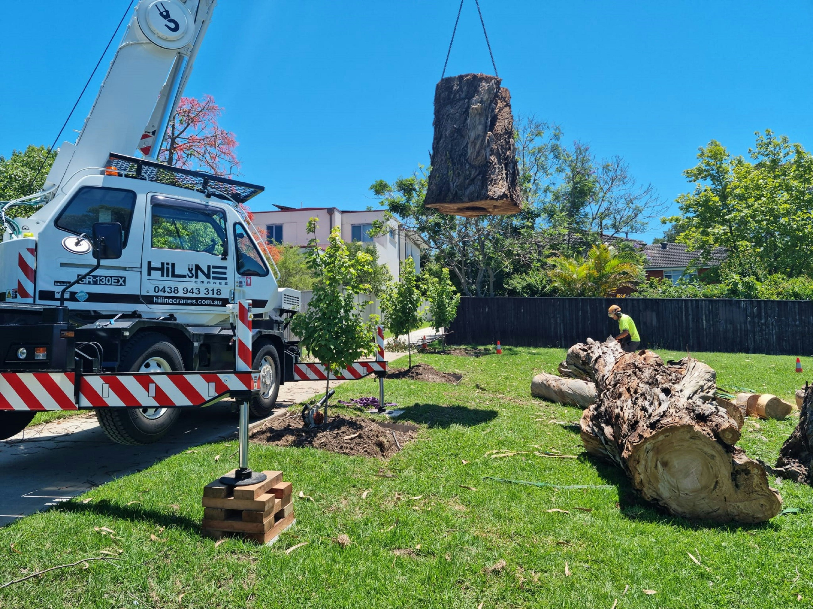 Happy Tree Service crew on job site with equipment